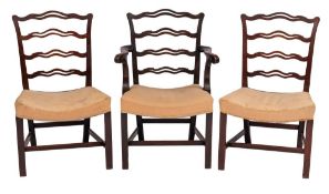 A set of six George III mahogany ladderback dining chairs:,