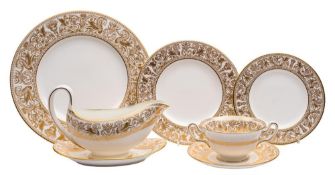 A Wedgwood gilt 'Florentine' dinner service: comprising eleven dinner plates, twelve side plates,