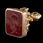 A 9ct gold fob seal: with a carved agate intaglio, 18gms gross weight.
