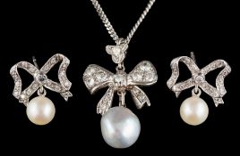 A cultured pearl and diamond pendant: the 9mm cultured pearl drop below a brilliant cut diamond set
