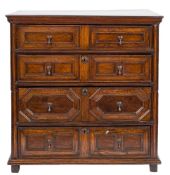 A 17th Century oak rectangular chest in two parts:, with a moulded top,