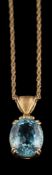 An 18 carat gold aquamarine pendant: the oval cut aquamarine in a four claw setting, stamped 750,