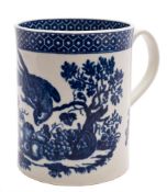 A First Period Worcester blue and white cylindrical mug: printed in the 'Parrot Pecking Fruit'