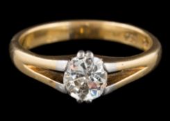 A diamond single-stone ring: set with a cushion shaped old cut diamond, estimated to weigh 1.
