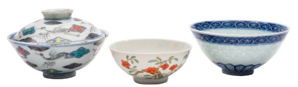A group of three Chinese bowls: comprising a small bowl finely painted with two knarled branches of