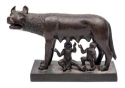 A late 19th/early 20th century bronze group of Romulus and Remus: the two infants suckling on the
