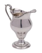An Edward VII silver cream jug, maker William Aitken, Birmingham,