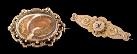 A Victorian oval mourning brooch and a Victorian 9ct gold bar brooch inset with a single diamond: