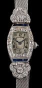 An Art Deco diamond and synthetic sapphire lady's cocktail watch: the white face with black