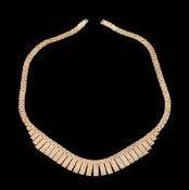 A 9 carat gold necklace: composed of graduating textured panels, to a concealed clasp, stamped 375,