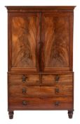A Regency mahogany and inlaid linen press:, bordered with ebony and boxwood lines,