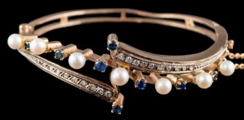 A Continental pearl, sapphire and diamond bracelet: the hinged bracelet set with pearls,