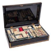 A 19th century Chinese export lacquer games box: of rectangular outline with gilt floral banded