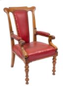! A Victorian walnut library armchair:, of large size,