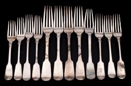 A collection of silver Fiddle pattern table and dessert forks,