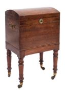 An early 19th Century mahogany domed top trunk shaped cellarette:,