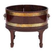A George III mahogany and brass bound oval wine cooler on a later stand:,