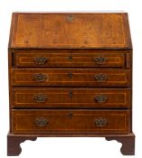 An early 18th Century walnut and cross and feather banded bureau:,