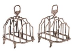 A pair of Edward VII silver four-division toast racks, maker William Hutton & Sons Ltd, Sheffield,