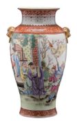 A Chinese famille rose baluster vase: with gilt lion dog ring handles,