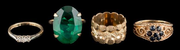 Four various 9 carat gold rings: a green single-stone dress ring, a band,