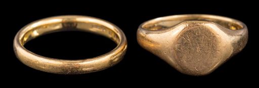 A 22 carat gold ring: the plain polished band stamped 22 with full London hallmarks for 1928,