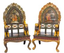 A pair of contemporary Indian carved wood and decorated throne armchairs:,