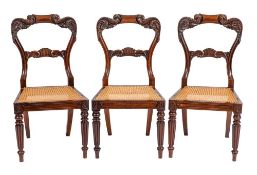 A set of six William IV carved rosewood dining chairs:,