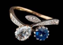 A sapphire, white sapphire and diamond cross over ring,