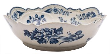 A First Period Worcester blue and white junket/salad bowl: with shaped rim and moulded with shells,