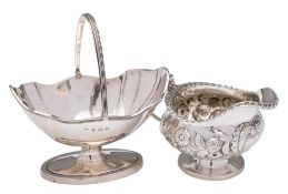 A George IV silver cream jug, maker WH, London, 1827: initialled,