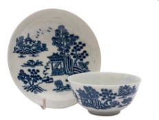 A large First Period Worcester blue and white teabowl and saucer: decorated in the early print 'The