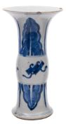 A Chinese blue and white Gu-form beaker vase: painted with auspicious objects and lappets,
