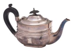 A George V silver bachelor's teapot, maker's mark worn, London, 1917: crested and inscribed,
