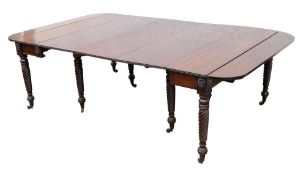 A Regency mahogany drop flap extending dining table:, with a telescopic action,