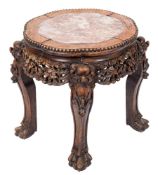 A Chinese carved hardwood urn stand:, of shaped circular outline,
