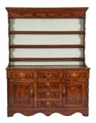 An early 19th Century oak and crossbanded dresser:,