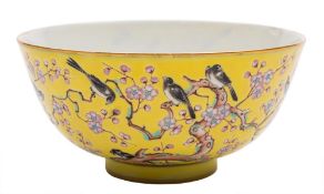 A Chinese yellow-ground 'Magpie and Prunus' bowl: finely painted with magpies perched and flying