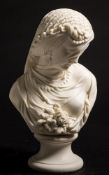 A Robinson and Leadbeater parian bust of a veiled girl: looking demurely downwards with eyes closed,