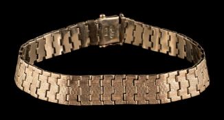 A flexible-link bracelet: the clasp stamped '9ct', approximately 12gms gross weight.