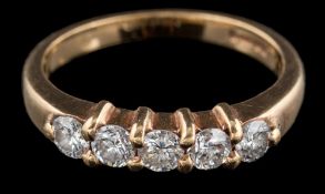A 9 carat gold diamond five stone ring: the brilliant cut diamonds, approximately 0.
