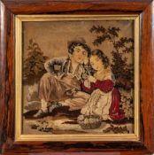 A Victorian woolwork picture: depicting a peacock and peahen in a naturalistic setting,