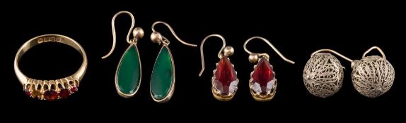 A garnet ring: set with circular cut garnets, ring size O 1/2; a pair of garnet drop earrings,