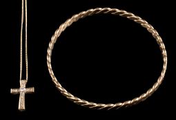 A 9 carat gold rope twist bangle: stamped 375 with import marks, 6.
