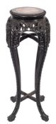 A Chinese carved hardwood circular jardiniere stand:,