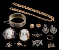 An oval shell cameo and jet brooch:, two silver medallions, a hinged bangle and ten various items.