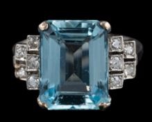 An aquamarine and diamond ring: the rectangular cut aquamarine in a four claw setting,
