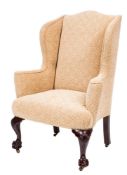 A carved mahogany wing frame armchair in the Georgian taste:,