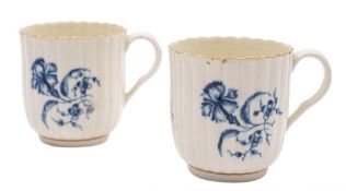 A pair of First Period Worcester blue and white coffee coffee cups and a sparrow beak cream jug: