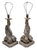 A pair of resin and brass effect table lamps: in the form of three entwined dolphins,